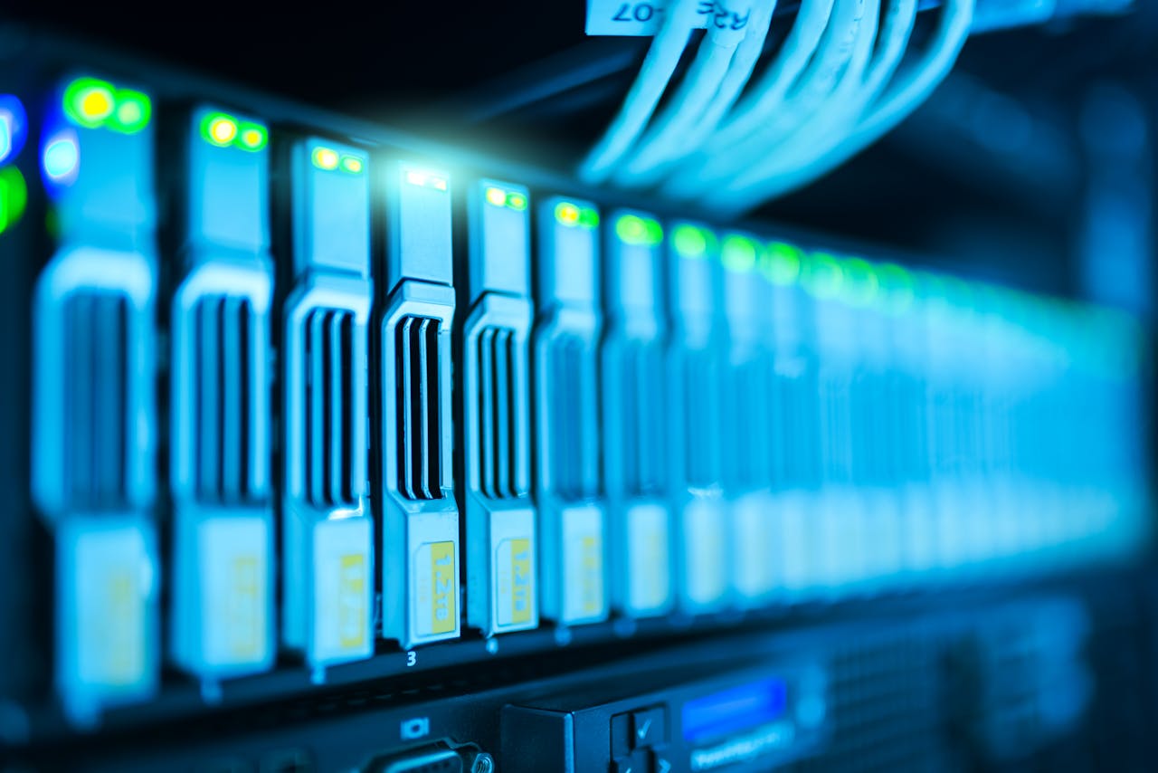 gallery-03 Detailed image of a server rack with glowing lights in a modern data center.